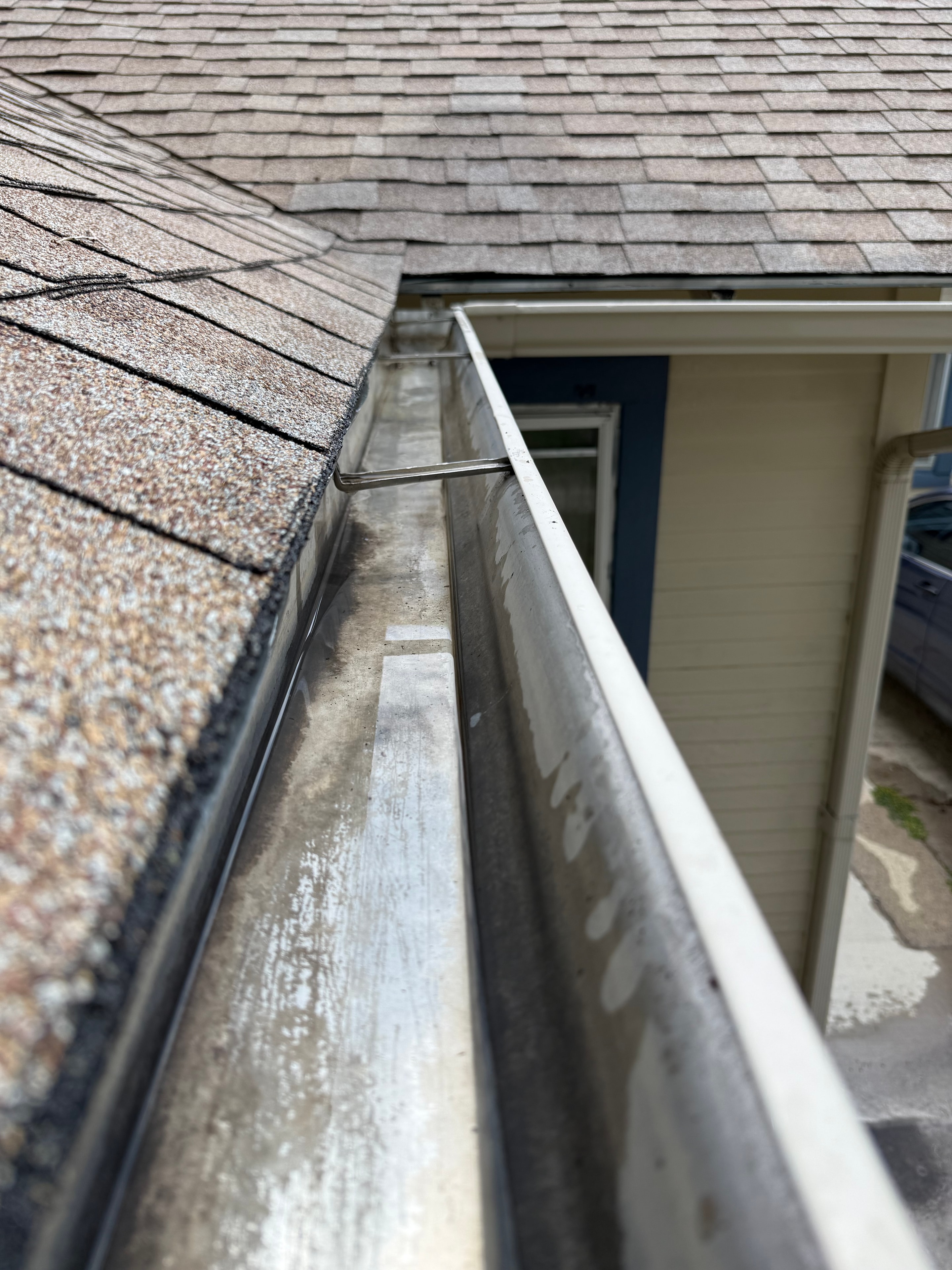 Clean gutter after professional cleaning by Nash & Co.